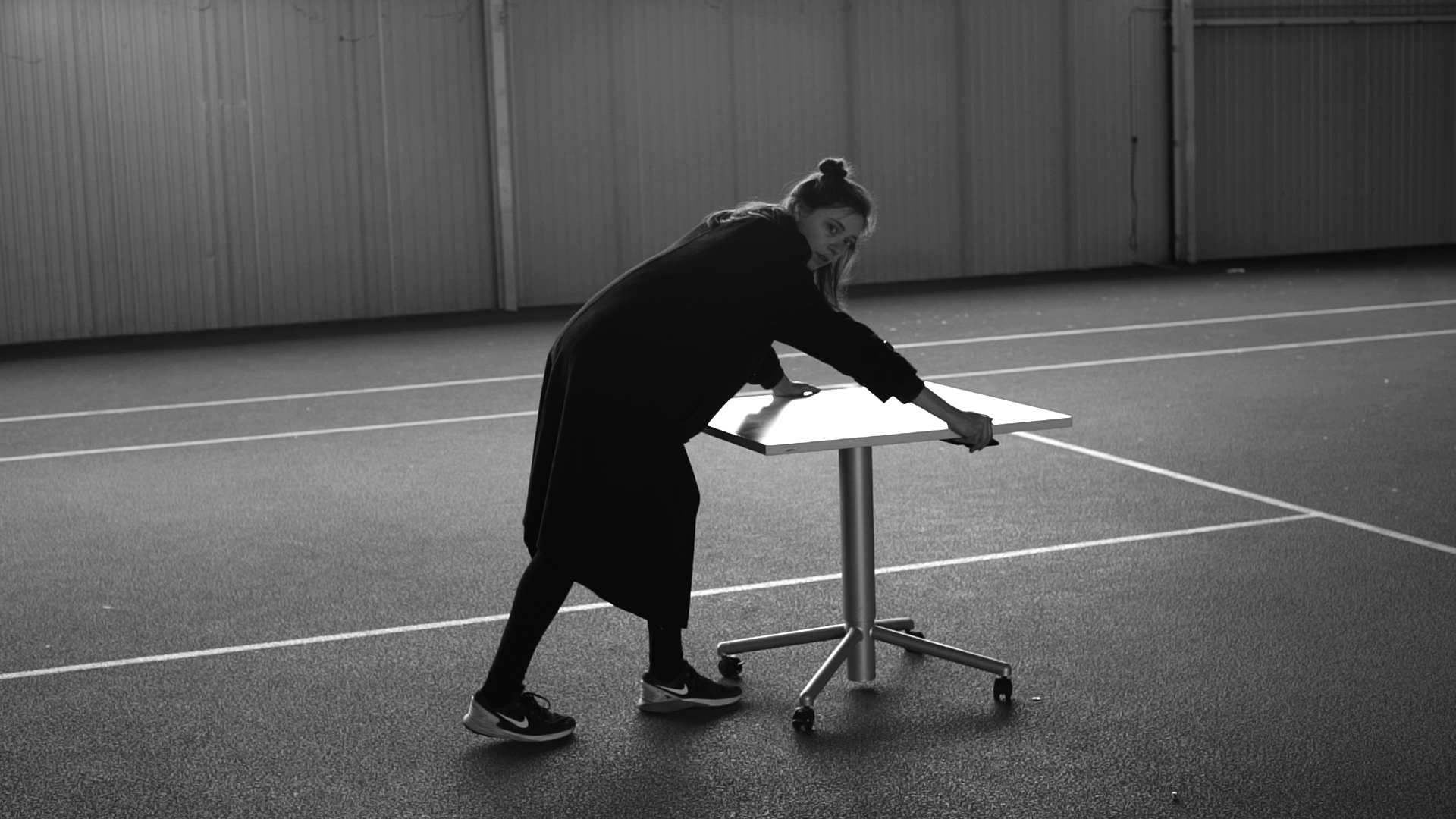 S and a table on a tennis court (still)